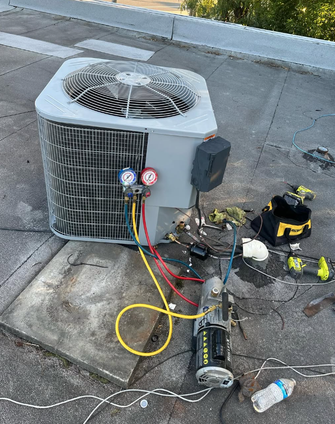 Commercial rooftop HVAC unit being serviced by El Potro